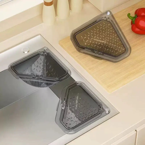 Magnetic draining triangular kitchen sink filter for storing food scraps, leftovers, and kitchen waste.