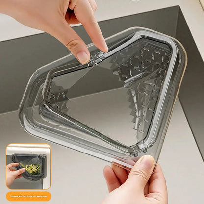 Magnetic draining triangular kitchen sink filter for storing food scraps, leftovers, and kitchen waste.